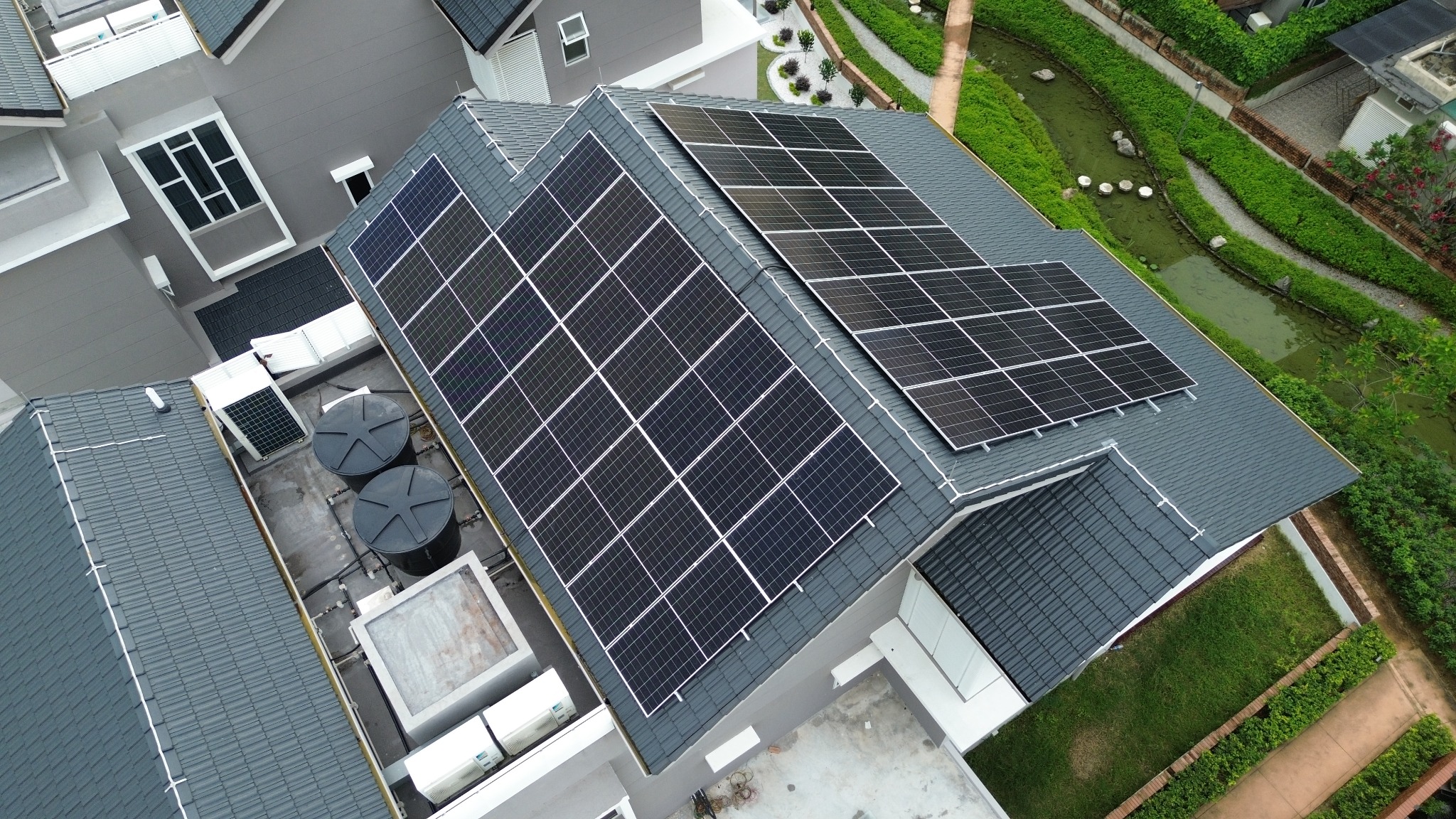 Large residential rooftop solar installation on a modern Malaysian home