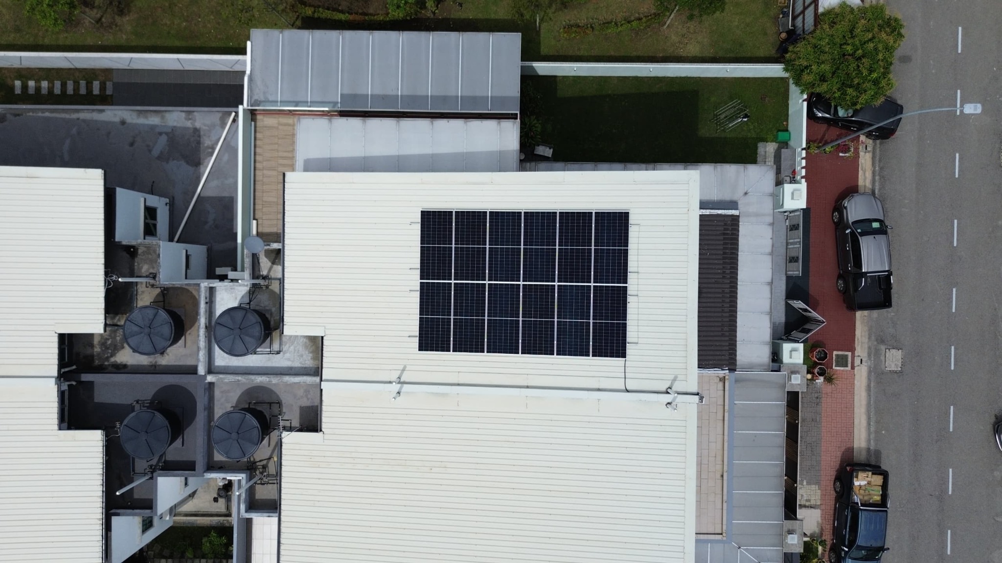 Neatly aligned solar panels on a residential roof viewed from above